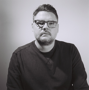 Justin Baker, guy with glasses